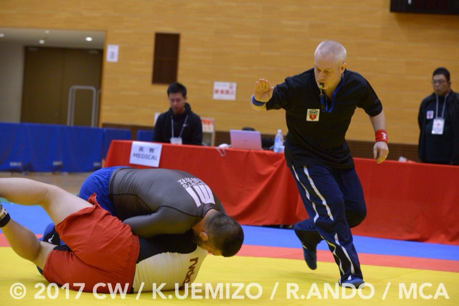 Coach Stephen Koepfer refereeing a sambo match